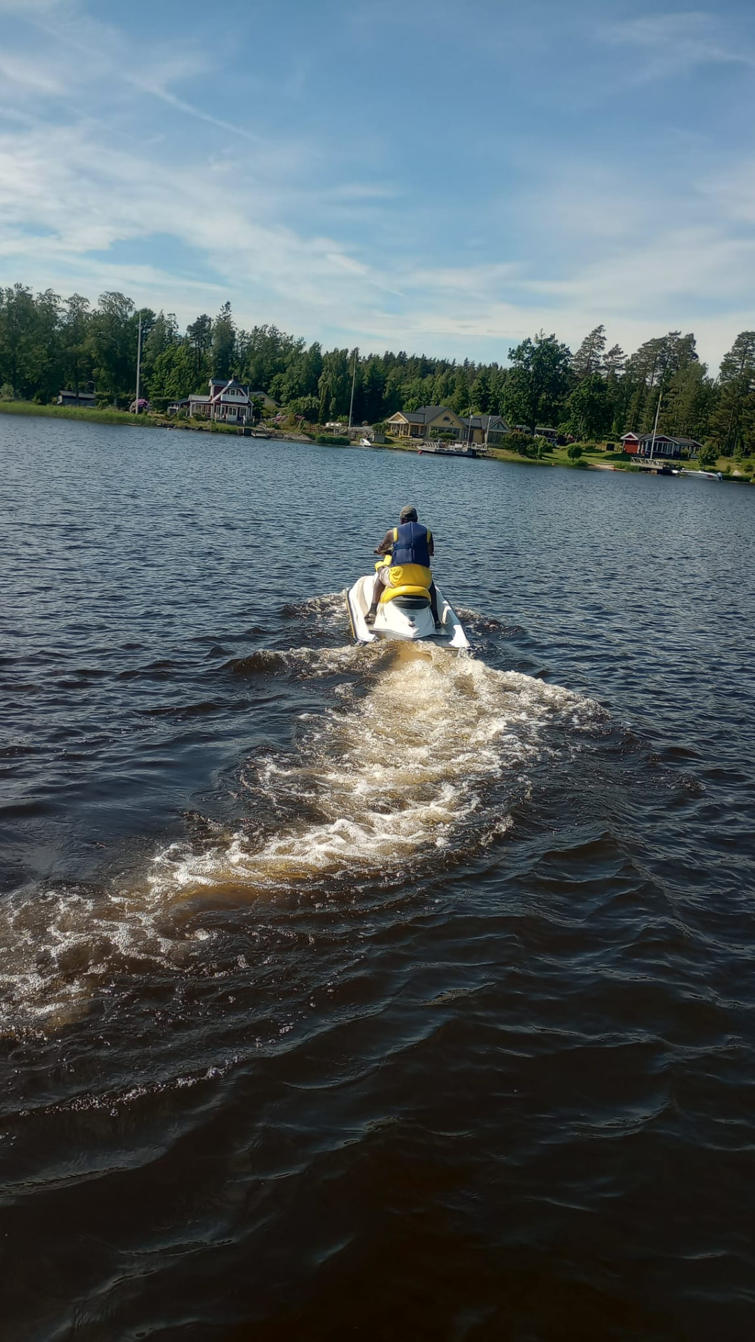 Guest riding a jet ski with our safety crew